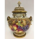 A Royal Worcester twin handled fruit painted vase and cover, signed Freeman,