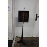 A 19th Century pole screen and a set of fire bellows (2)