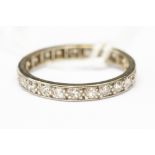 A platinum and diamond fully set eternity ring, approx 2.