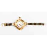 An unusual shaped watch 18k gold, converted to wristwatch from fob watch, World War One circa,
