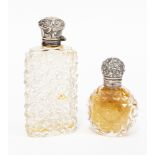 Two cut glass silver capped Victorian perfume bottles/smelling salts,