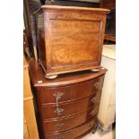 A Georgian style mahogany bow fronted chest of drawers, fitted with four drawers,