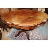 A Victorian mahogany pedestal centre table, of oblong form, having a frieze drawer,