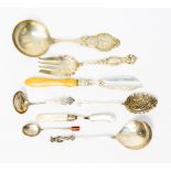 Silver flatware including Dutch Apostle spoon, American tomato fork, sifting spoon,