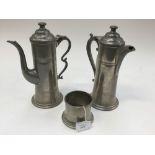 Two manor pewter water jugs and one other