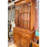 A reproduction yew wood glazed bookcase cabinet,