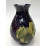 Moorcroft Anemone pattern vase on blue ground, paper label to base,