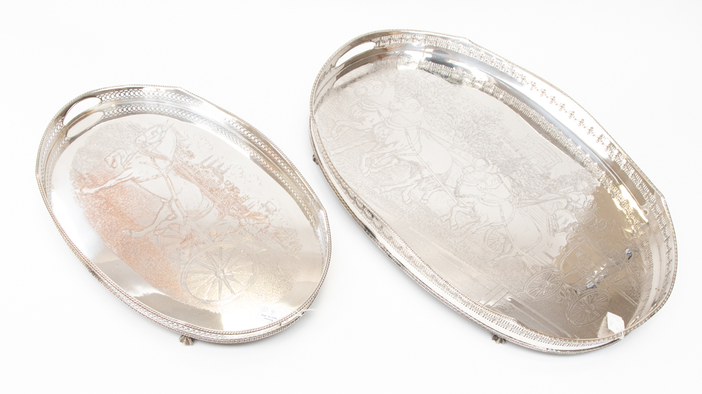 A large oval silver plated gallery tray engraved with a coach and horses and a similar,