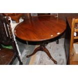 A George III mahogany tilt top tripod table,