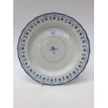 A Derby porcelain plate, cold blue decoration, a central floral spray within arrows,