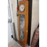 An oak cased electric powered wall clock, the dial inscribed 'Magneta,