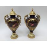 A pair of Coalport twin handled pedestal vases, with covers, hand painted, fruit pattern,