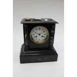 Black marble mantle clock with etched detailing, eight days, Roman numerals,