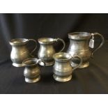 An approx graduated set of five pewter baluster series measures