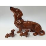 A large Beswick 1950s Dachshund and two Beswick small Dachshunds (3)