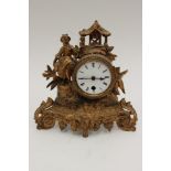 A Victorian gilt spelter mantle clock, with a white enamelled dial, black Roman numerals,