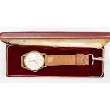 A gents 9ct gold Garrard wristwatch on leather strap,