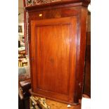 A 19th Century mahogany hanging corner cupboard,