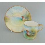 A Minton Coffee Can and Saucer Hand Painted with a Widgeon on a Lake Scene. Can. Signed A Holland.