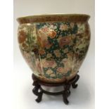 Large Oriental jardiniere on stand with floral and figural decoration (2)