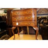 A Queen Anne style walnut chest of drawers, fitted with three drawers,