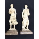 A pair of European carved ivory figures of maidens in the classical style, late 18th Century,