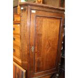 A George III oak and mahogany cross-banded corner cupboard