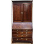 A George III mahogany bureau bookcase, in the Chippendale manner,