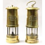 A pair of minors lamps each having an oval plate depicting Welsh Dragon and marked 'Cymru',