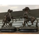 A pair of Spelter figures of boys with horses (2)