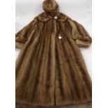 A ladies calf length mink coat, beige,