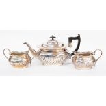 A Viners silver plated three piece tea service, in the Regency style, comprising teapot,