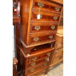 A pair of Georgian style walnut chest of drawers,