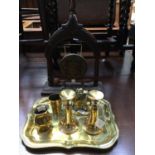 Indian brass ware to include a carved wooden mid 19th Century Bidri brass gong,