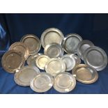 A group of seventeen pewter flatware plates,