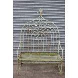 A Wrought iron garden seat with arched back,