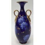 A Royal Doulton twin handled vase 'Chrysanthemum' pattern on cobalt ground Rd 1755