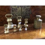 A 50oz lead and brass cylindrical weight and seven other brass weights,