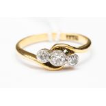 An 18ct gold and diamond three stone ring