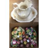 A jug and bowl and five ceramic flower arrangements (7)