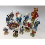 Thirteen boxed Rupert Bear models, of which 6 are Royal Doulton, and 7 are Kevin Francis.