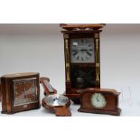 An early 20th Century oak cased clock with plaque dated 1915;