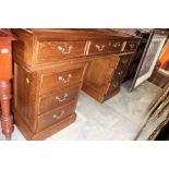 A traditional hand crafted solid oak pedestal desk