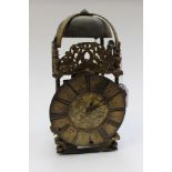 An 18th Century lantern clock, by Richard Manckland of Worcester, with two winder holes,