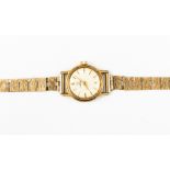 A ladies vintage Omega watch on a 9ct gold bracelet strap,