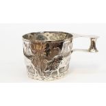 A silver cup depicting a classical scene of a farmer and his cattle, Dobson of Picadilly,