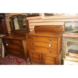 A George V oak mirror back dressing chest, circa 1925, fitted with two short over two long drawers,
