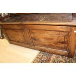 An early 18th Century elm chest, plank top,