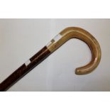 A Shepards Crook walking stick with a horn handle. Approx 110cm in length.