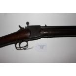 Giffard 8mm shotshell air rifle with long breech. Engraved steel, working action.